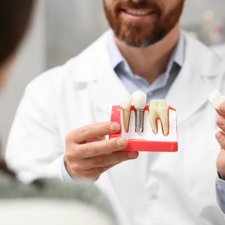 Model Surgeon Demonstrates Dental Implants